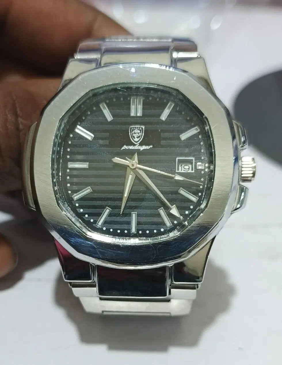 Luxury stainless steel men's analog watch by 1238 with a sleek round dial and classic design.