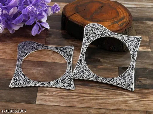 Silver-toned oxidised bangles with square shape pattern, ethnic kada from women's jewellery set, showcasing intricate traditional design.