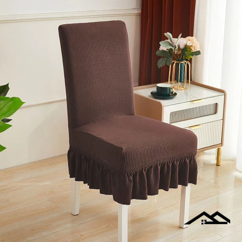 Set of four brown thick skirt sofa chair covers by 15631, showing durable fabric and tailored fit for furniture protection.