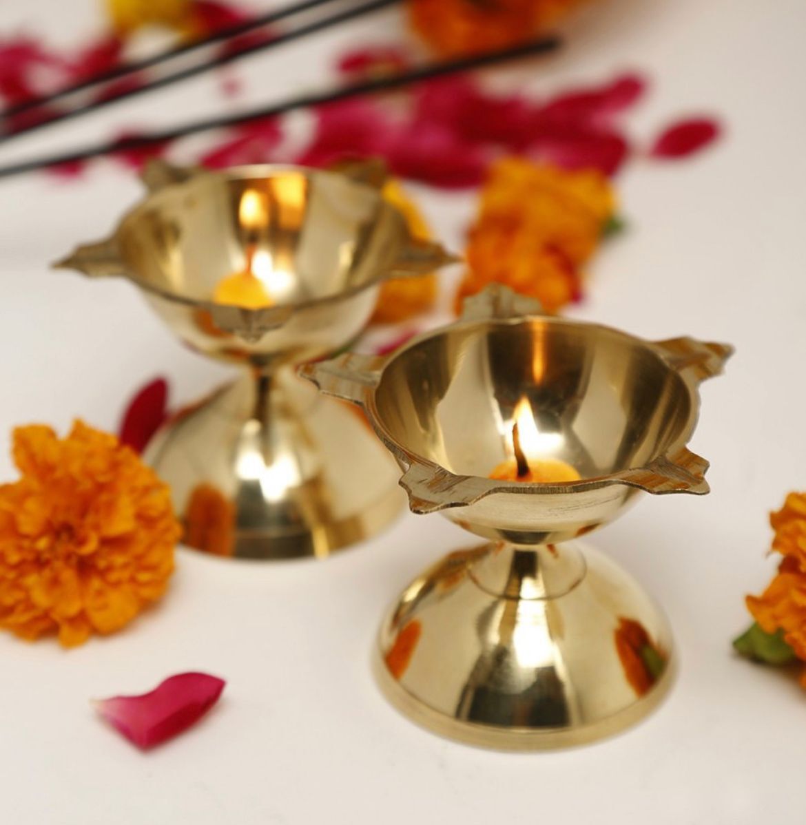 Two brass Panchmukhi Diyas in gold finish, traditional lighting lamps from 836, perfect for festive decorations.