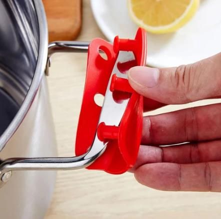 Silicone pot handle holder from 19378 kitchen tool set, heat-resistant silicone with textured grip for safe handling of hot cookware.