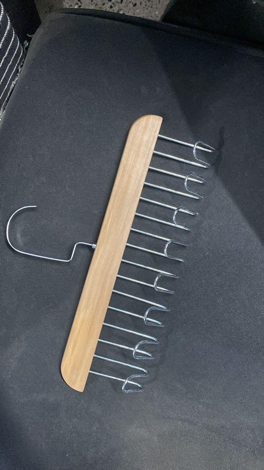 Set of two multifunctional wooden kitchen hangers with metal hooks, ideal for organizing utensils and accessories.