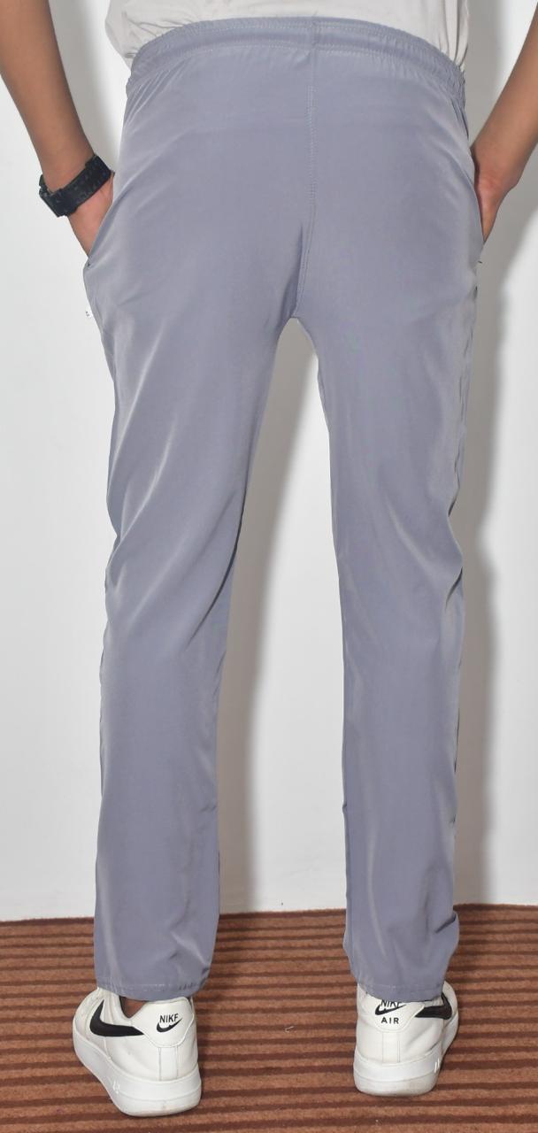 Boys multicolor striped and solid track pants from brand 18359, comfortable joggers with elastic waistband and tapered fit.