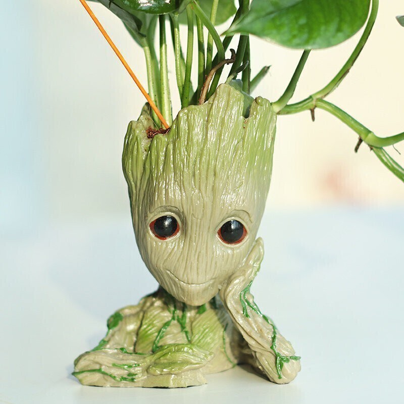 Basil seeds for good luck money plant in a Groot-themed decorative vase, ideal for home or office plant decor.