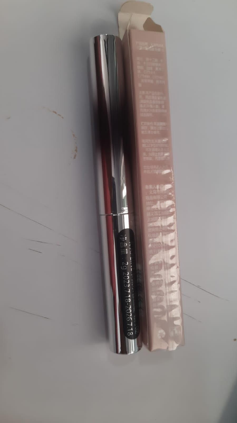 Set of two 19378 Iron Brush Mascara eye serums in sleek bottles, designed to enhance lash health and appearance.