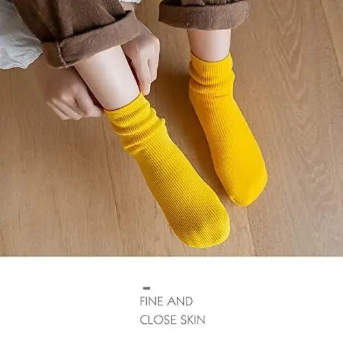 Two pairs of 19378 moisturizing thermal socks, thick and warm, designed to keep feet cozy and moisturized in cold weather.