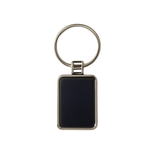 Black and silver metal rectangular keychain with Wukusy branding, featuring a sleek design and durable metal construction.