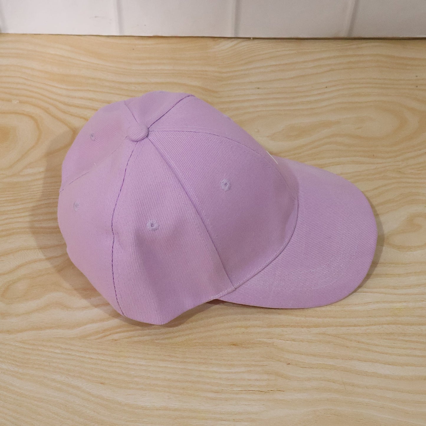 Wukusy stylish summer embroidered baseball cap for men and women, featuring colorful floral design on a casual cap.