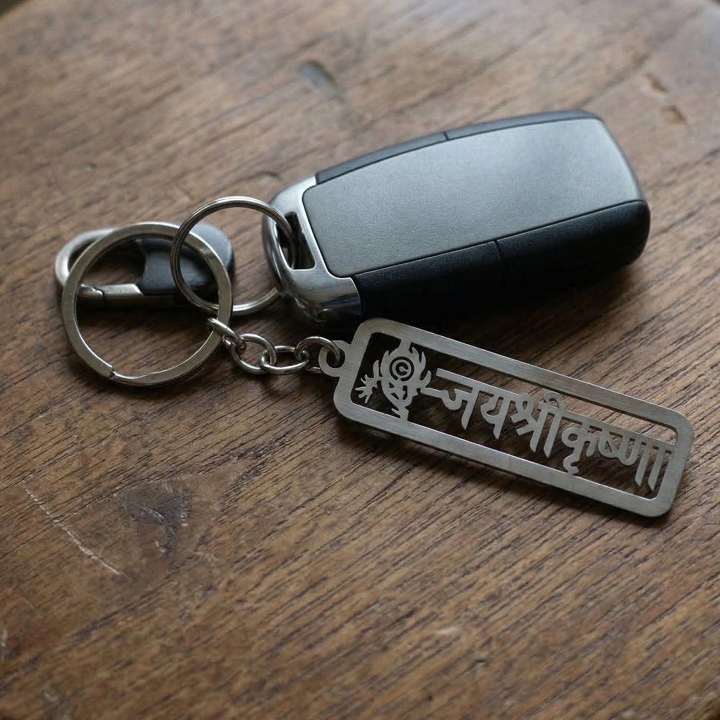 Premium metal Jay Shri Krishna engraved keychain by Wukusy, featuring intricate Krishna design and craftsmanship.