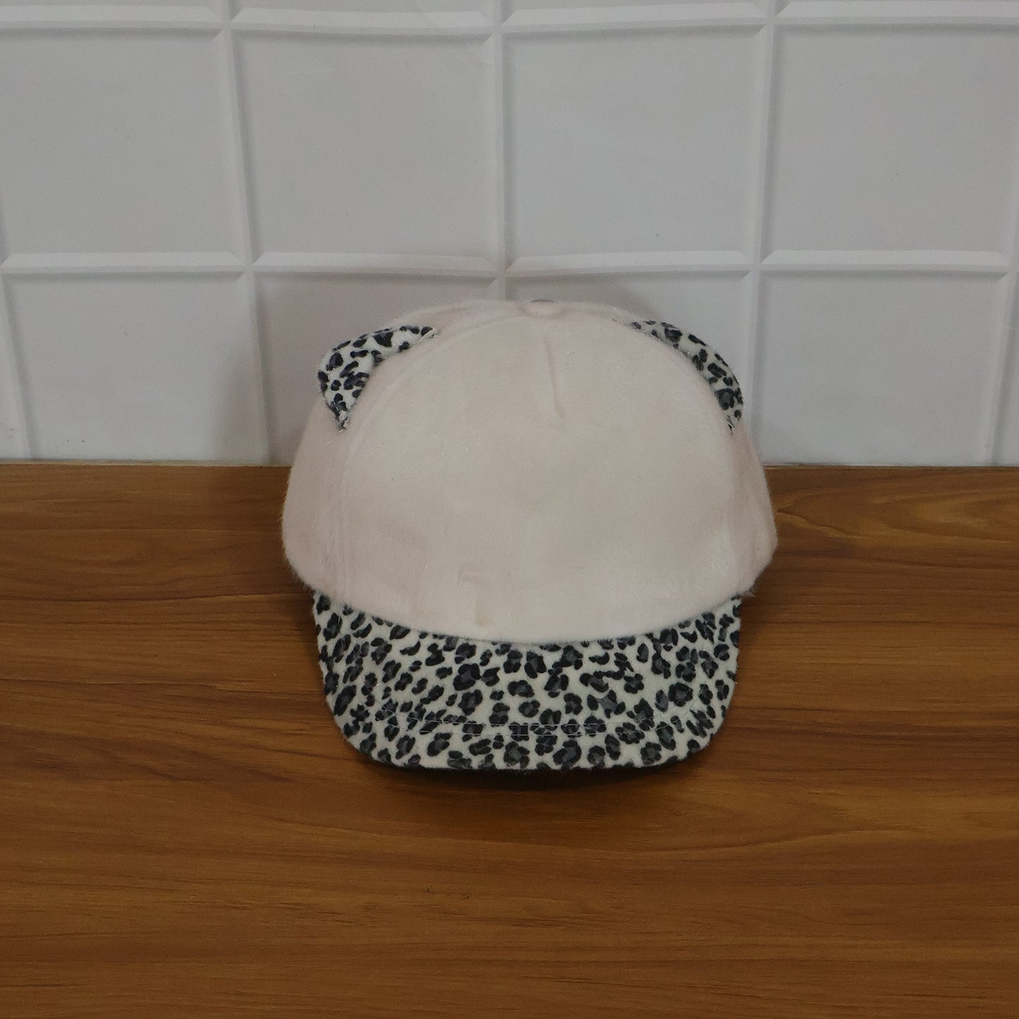 Wukusy stylish women's cat ear designer cap with pink accents, featuring playful cat ear details and adjustable strap.