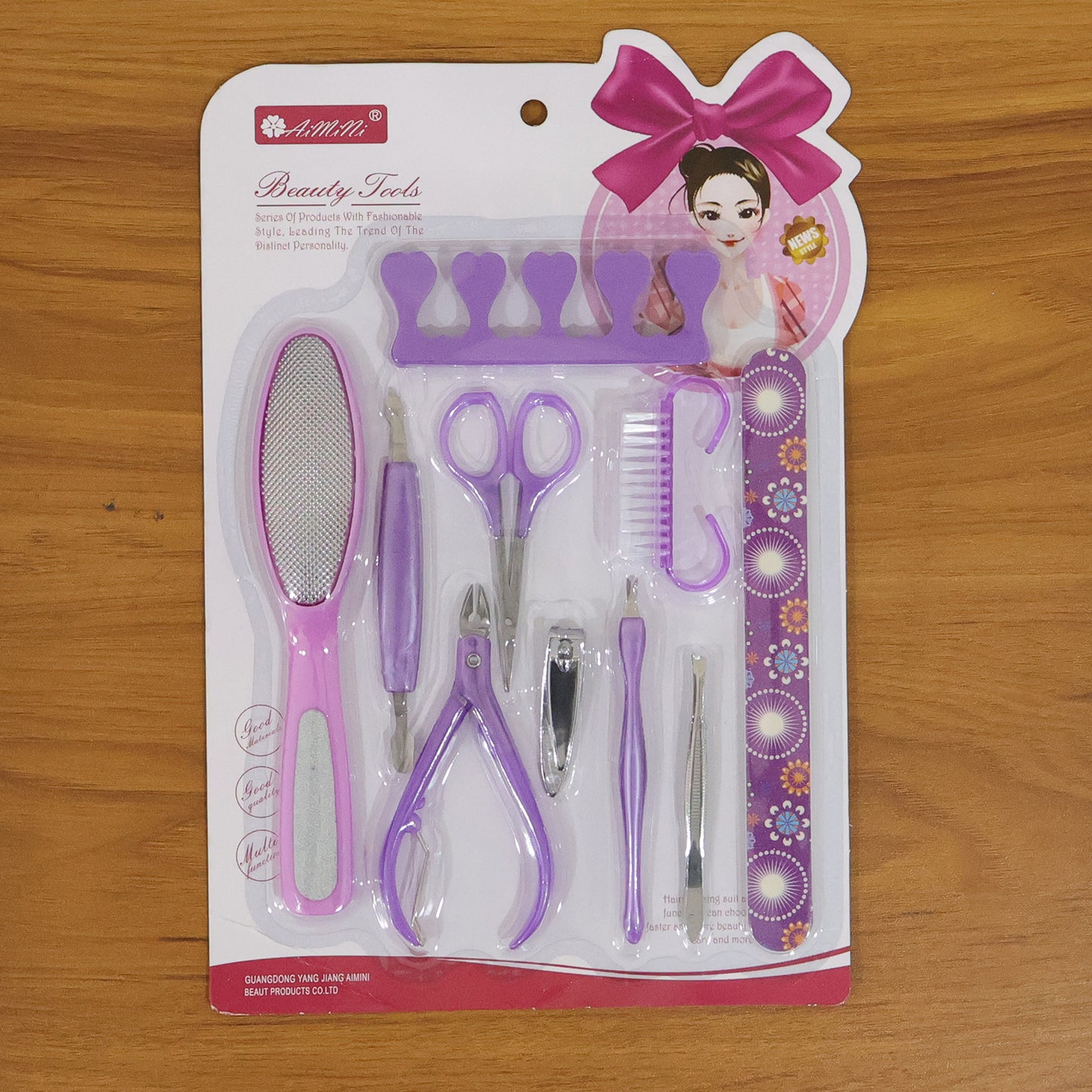 Wukusy 10-piece personal grooming manicure and pedicure nail care tool set with various nail clippers, scissors, and files.