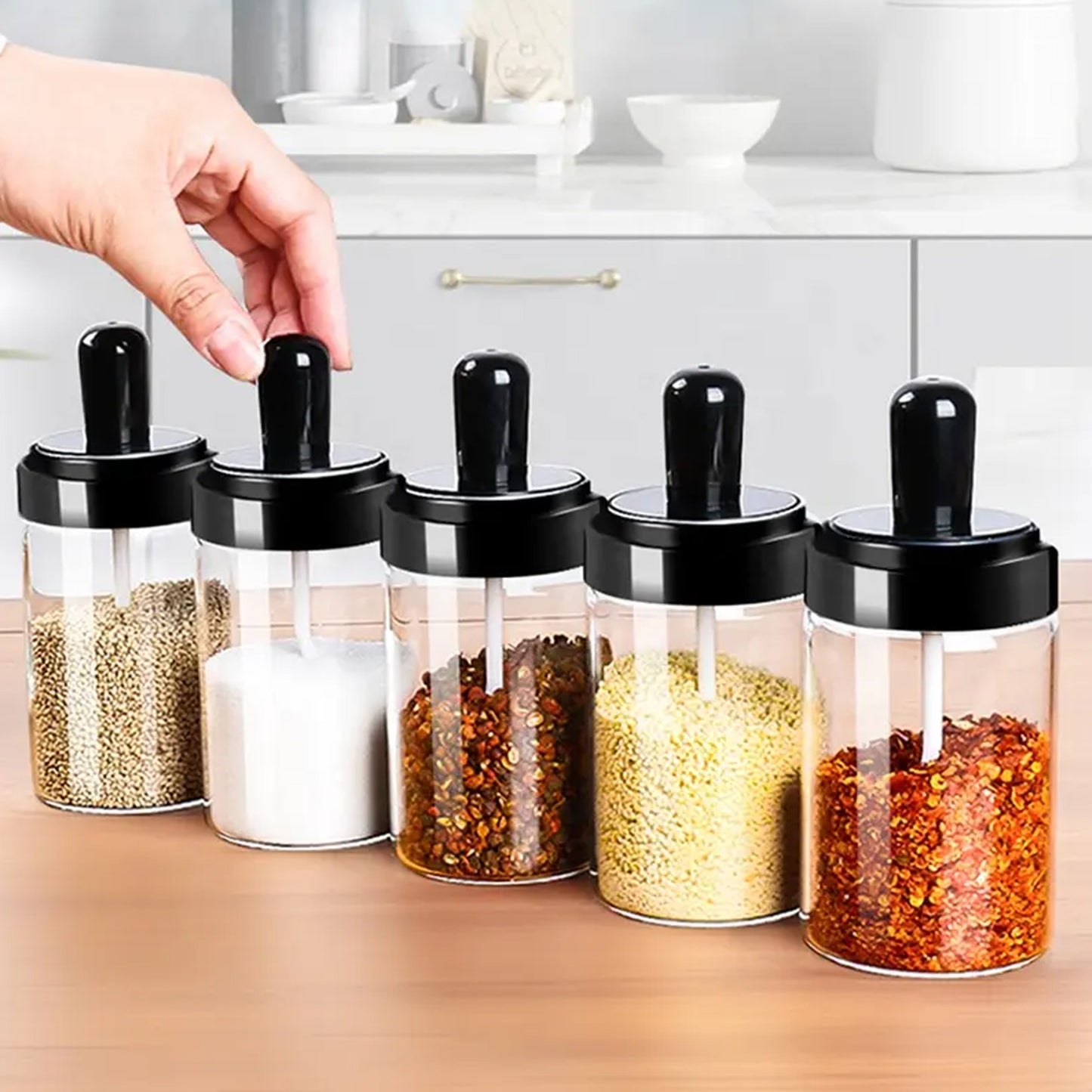 Wukusy spice box with four glass jars for masala and seasoning storage, ideal for kitchen organization and spice display.