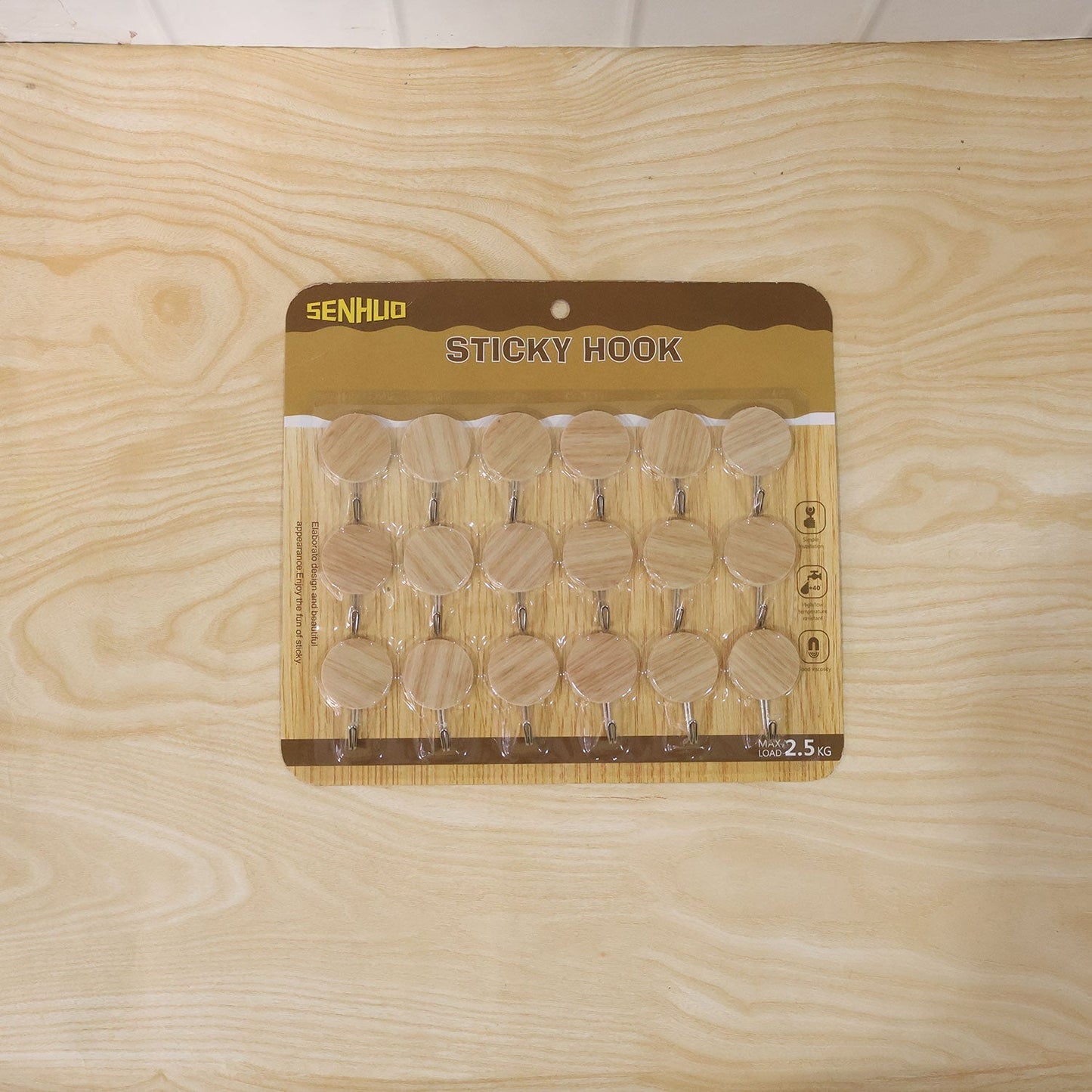 Wukusy self-adhesive wooden look wall hooks, strong sticky hangers without drilling, shown attached to a wall in a set of 18 pieces.