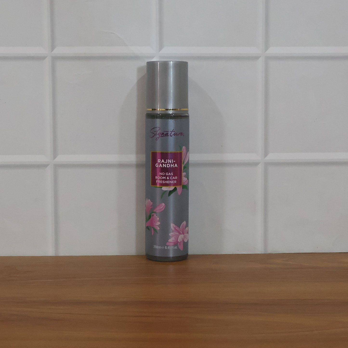 Wukusy Signature Rajnigandha room and car freshener spray bottle, 250ml, with floral fragrance and sleek design.