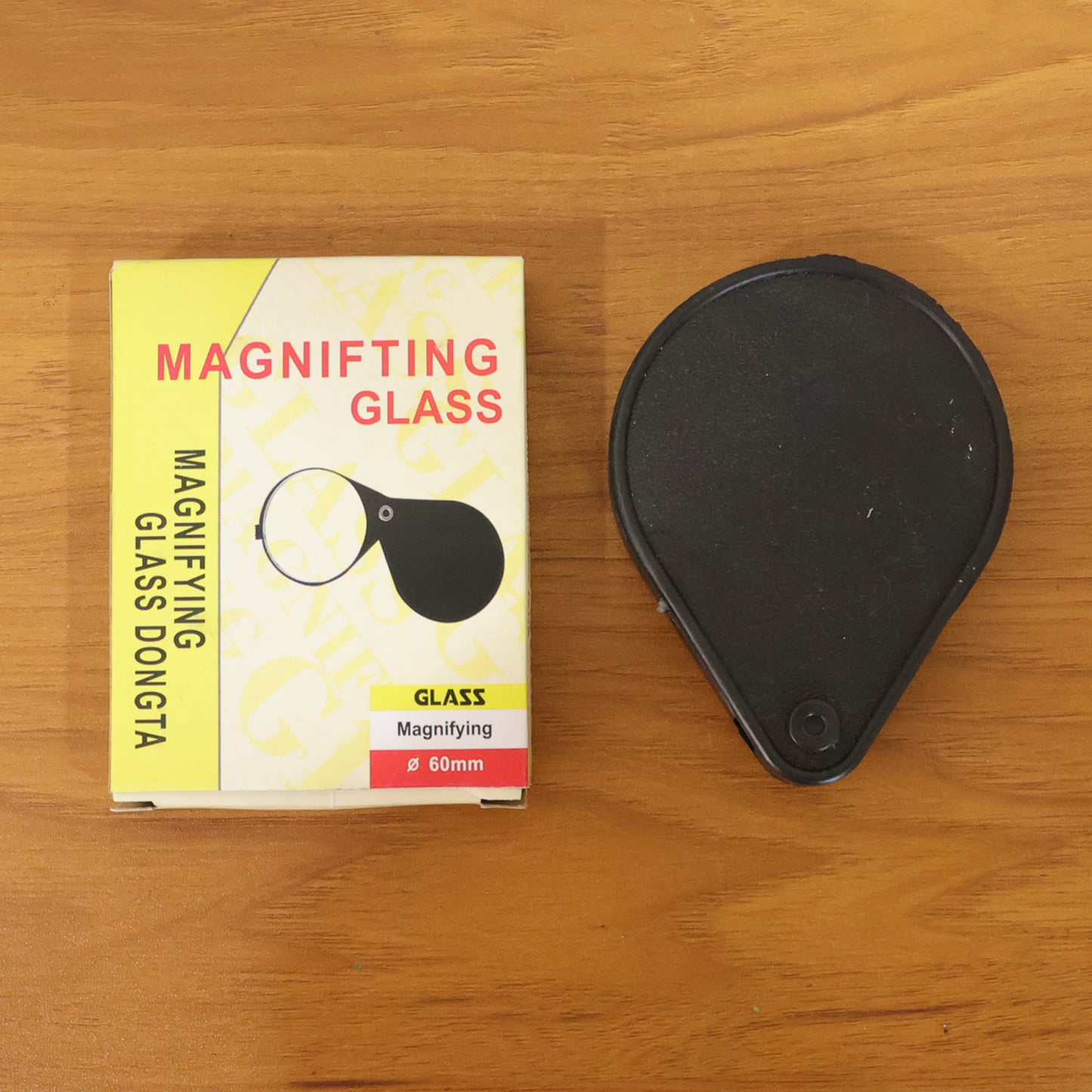 Wukusy portable handheld magnifying glass with ergonomic handle, close-up view showing clear lens for detailed inspection.