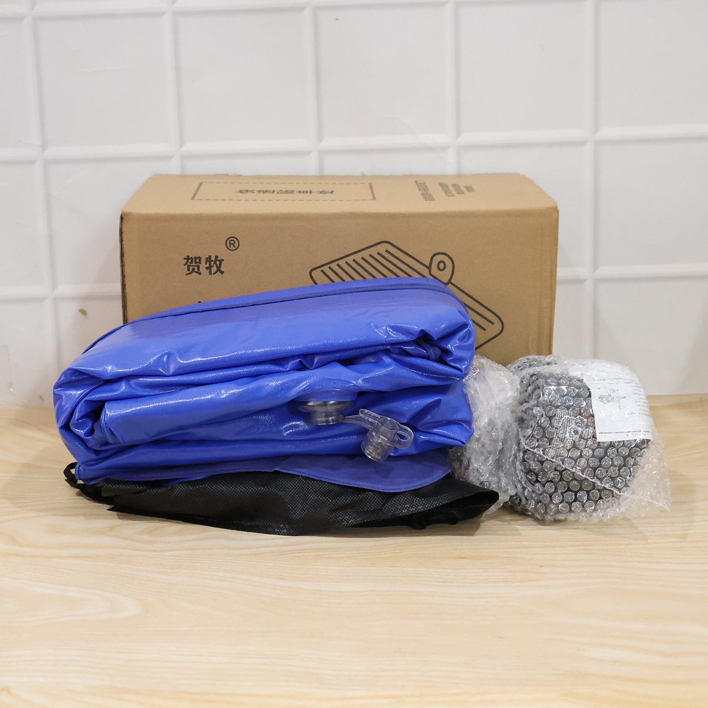 Blue Wukusy portable car air mattress bed set with pump and pillows, fully inflated for comfortable travel sleeping.