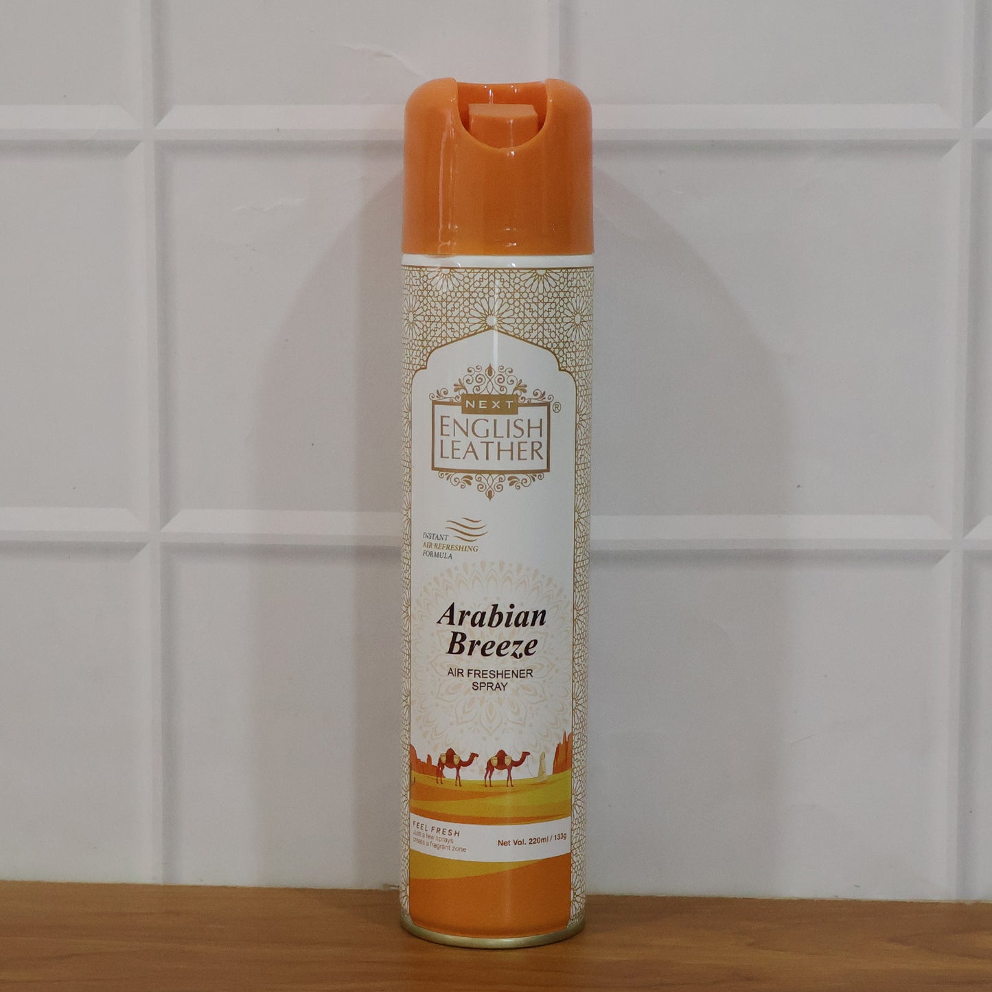 Next Premium English Leather Arabian Breeze air freshener spray by Wukusy, 220ml, featuring a sleek bottle with a spray nozzle.