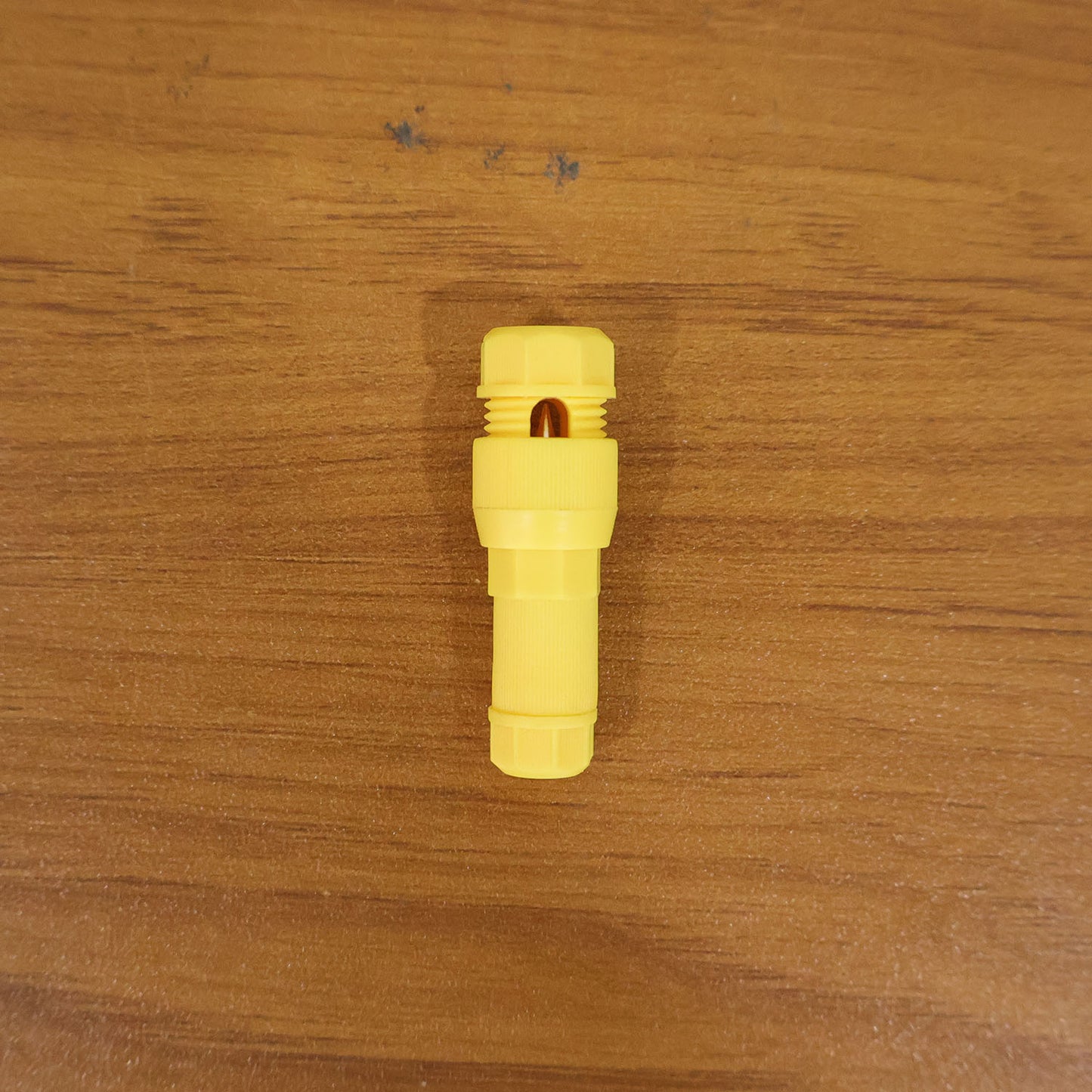 Wukusy Posi Tap Wire Connector in black, showing the insulated plastic housing and metal connection point for secure electrical wiring.
