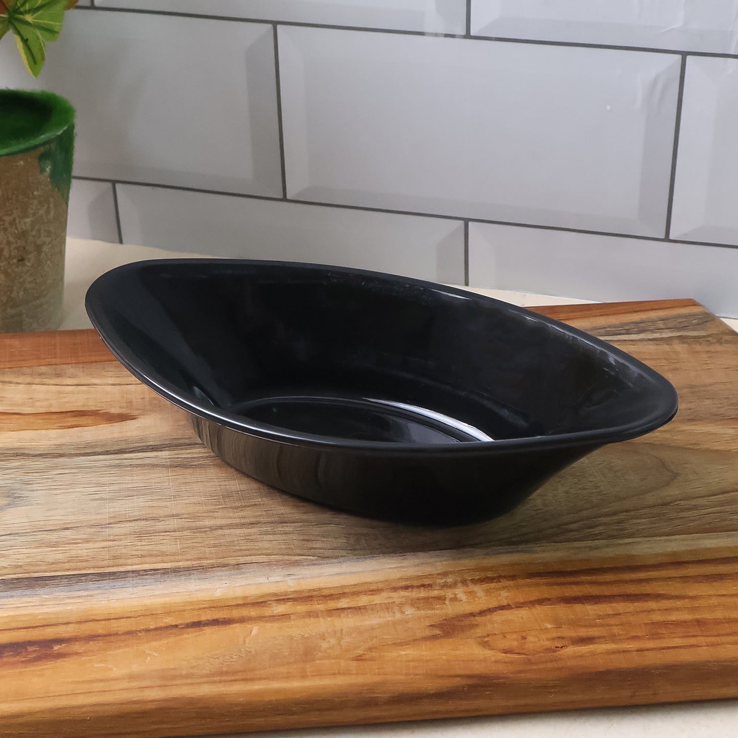 Wukusy Plastic Marin Serving Bowl, elegant black oval deep bowl, 6L capacity, ideal for salads and serving large dishes.