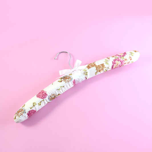 Wukusy premium padded floral clothes hanger with floral design, sturdy padding, and smooth finish for delicate garments.