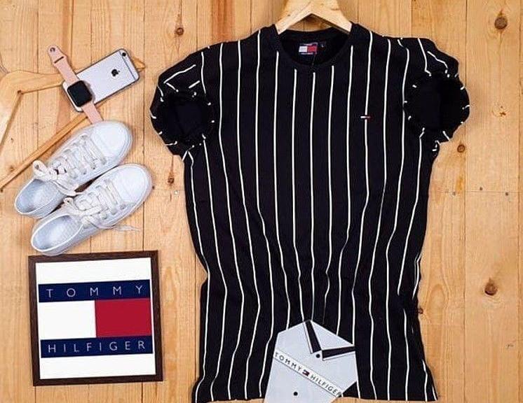 Black men's Regular Fit T-shirt by 8969, size L, made from comfortable soft fabric, shown laid flat.