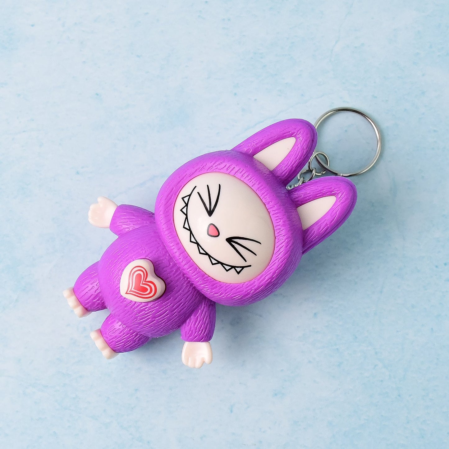 Wukusy cartoon character face-changing toy with key holder keychain, colorful plastic toy with expressive face design and keyring attachment.