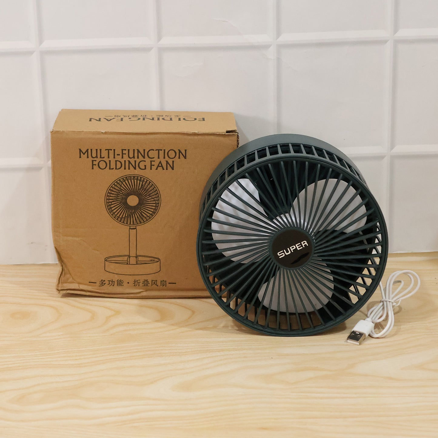 Wukusy USB portable desk fan with adjustable stand, compact cooling fan ideal for office use, shown on a desk.