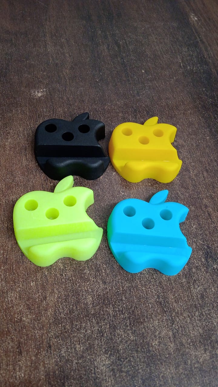 Colorful apple-shaped plastic mobile stand with integrated pen holder, featuring a sleek design ideal for desk organization.