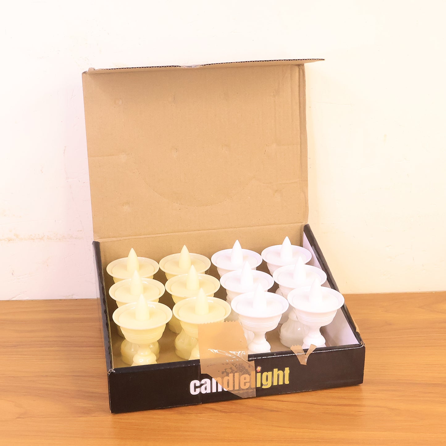 Set of 12 white water sensor LED diyas for home decor, featuring automatic lighting and elegant design by Wukusy.