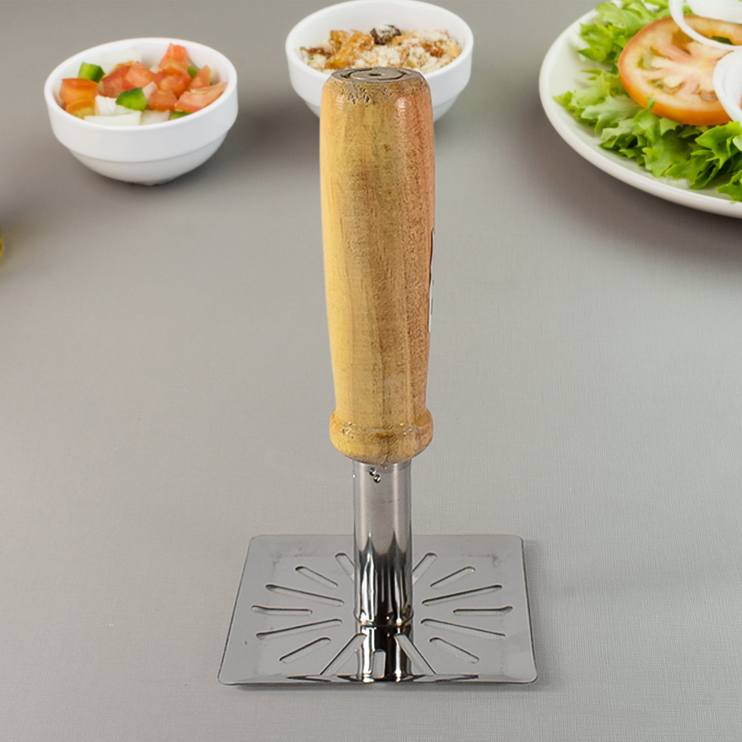 Wukusy stainless steel potato masher with wooden handle, square design, ideal for mashing potatoes and vegetables in the kitchen.