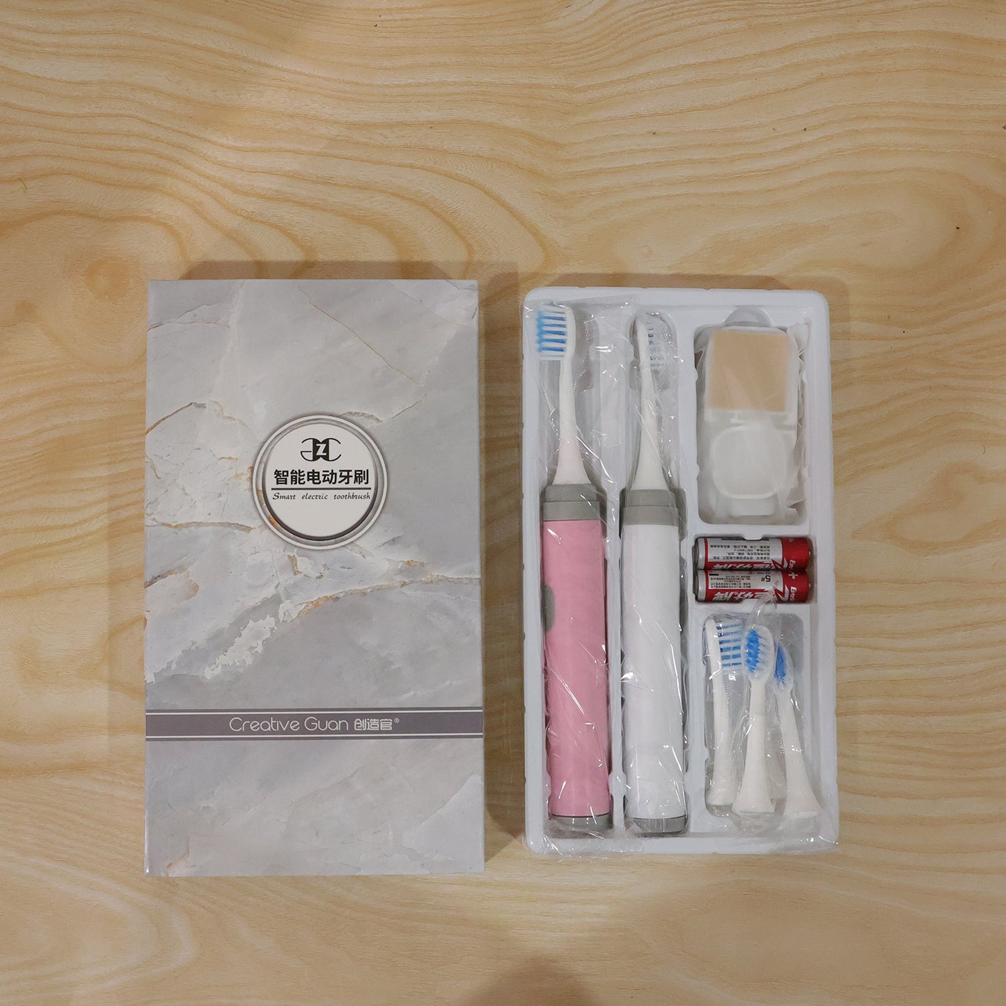 Wukusy kids electric toothbrush set with colorful handle and multiple replacement brush heads for gentle, effective dental cleaning.