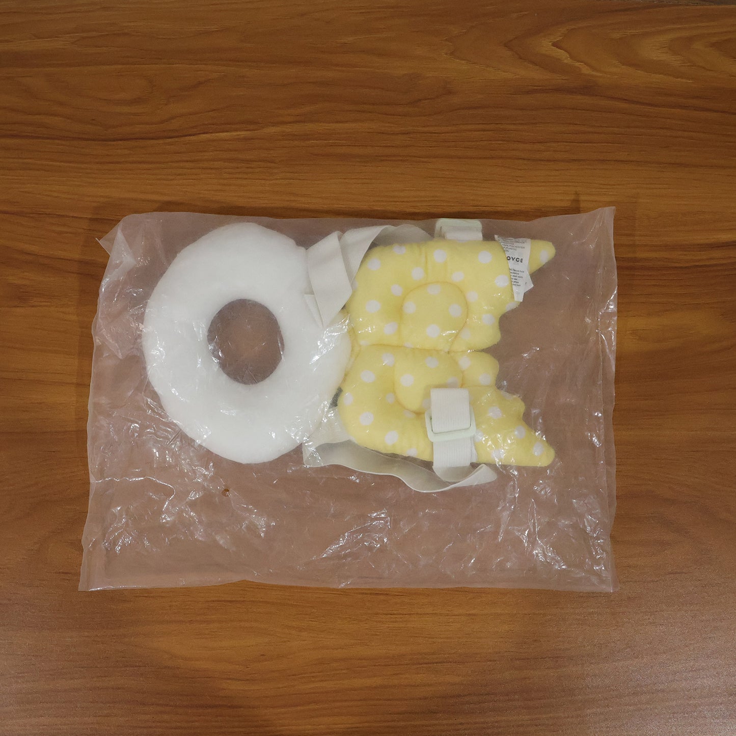 Wukusy small baby head protector safety cushion showing soft, padded surface designed to protect a baby's head during play or crawling.