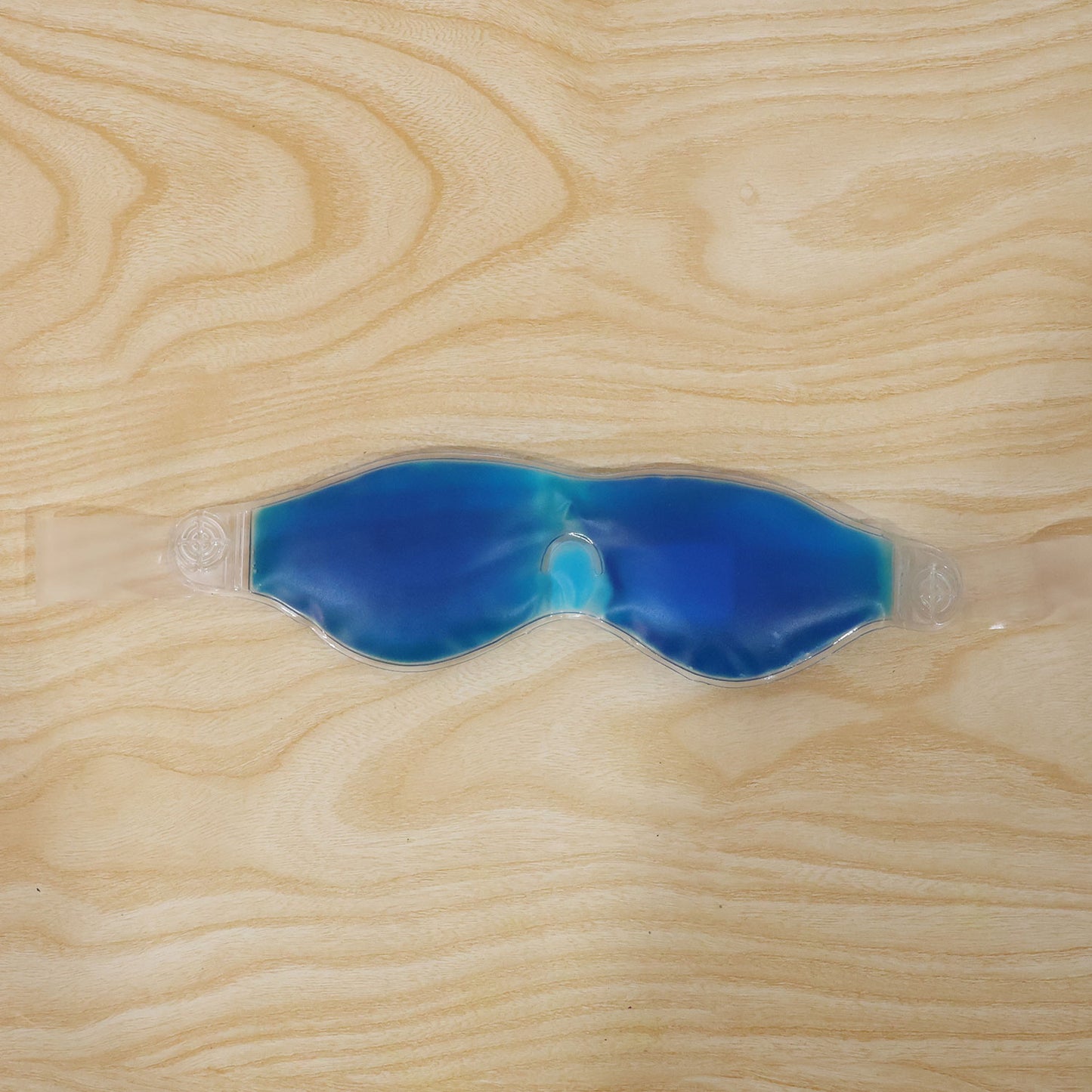 Small blue Wukusy cooling gel eye mask for relaxation and puffy eye relief, designed for soothing comfort.