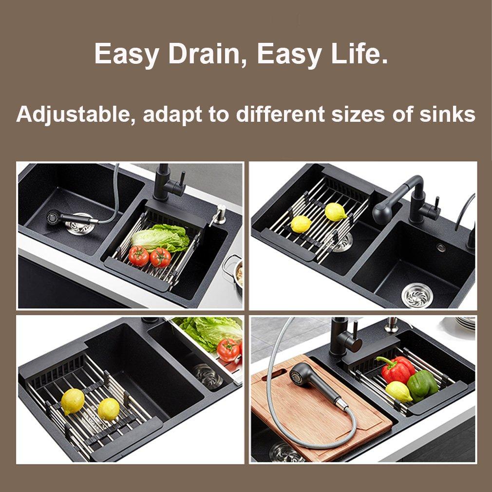 Wukusy stainless steel expandable kitchen sink dish drainer with multiple compartments for drying dishes and utensils.
