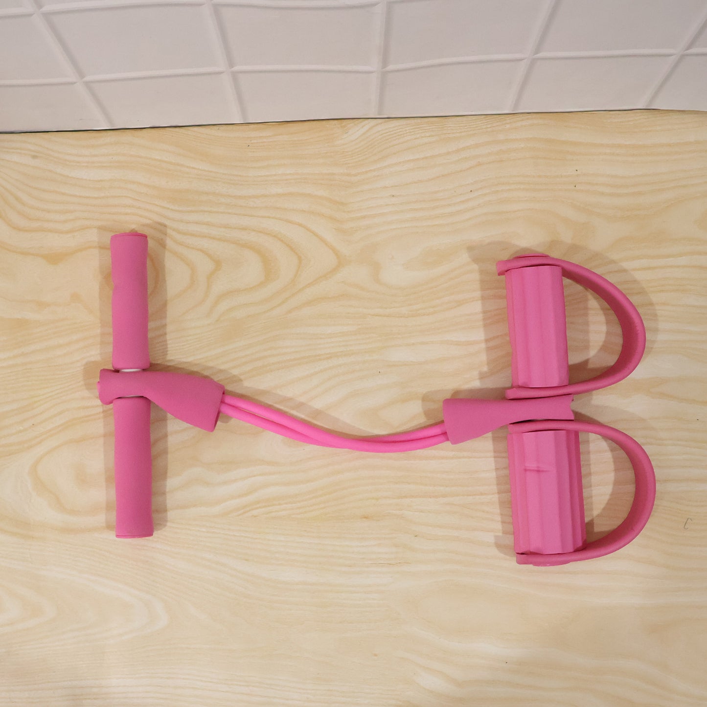 Wukusy portable pull rope resistance exerciser with foot pedal support for strength training and physical therapy exercises.