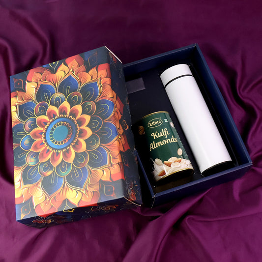 Wukusy Effete Kulfi Almonds Gift Hamper with a golden bottle, featuring two elegant packaging boxes for home and kitchen gifting.