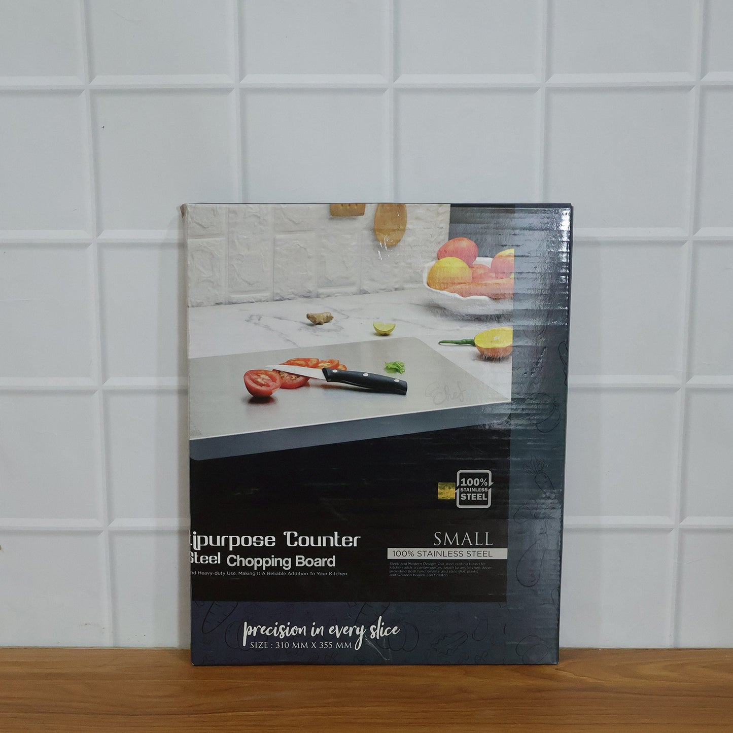 Wukusy stainless steel chopping board, 35.5x29 cm, 1mm thick, on a kitchen countertop with knives and vegetables.