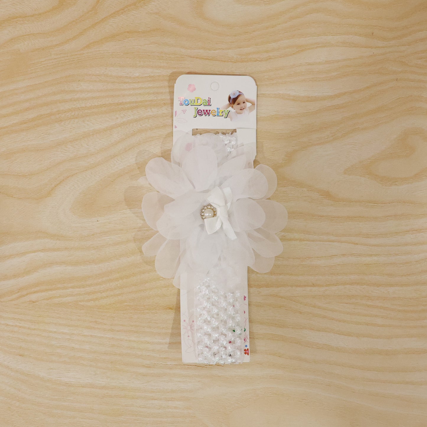 Cute soft elastic floral baby headband by Wukusy, stylish stretchable hair accessory for infants with colorful floral design.