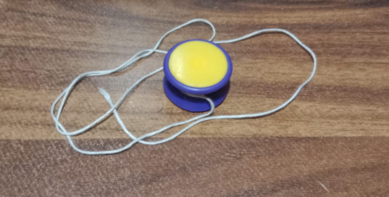 Wukusy small yoyo toy with string, rotating brain exerciser for kids, featuring colorful design and smooth spinning action
