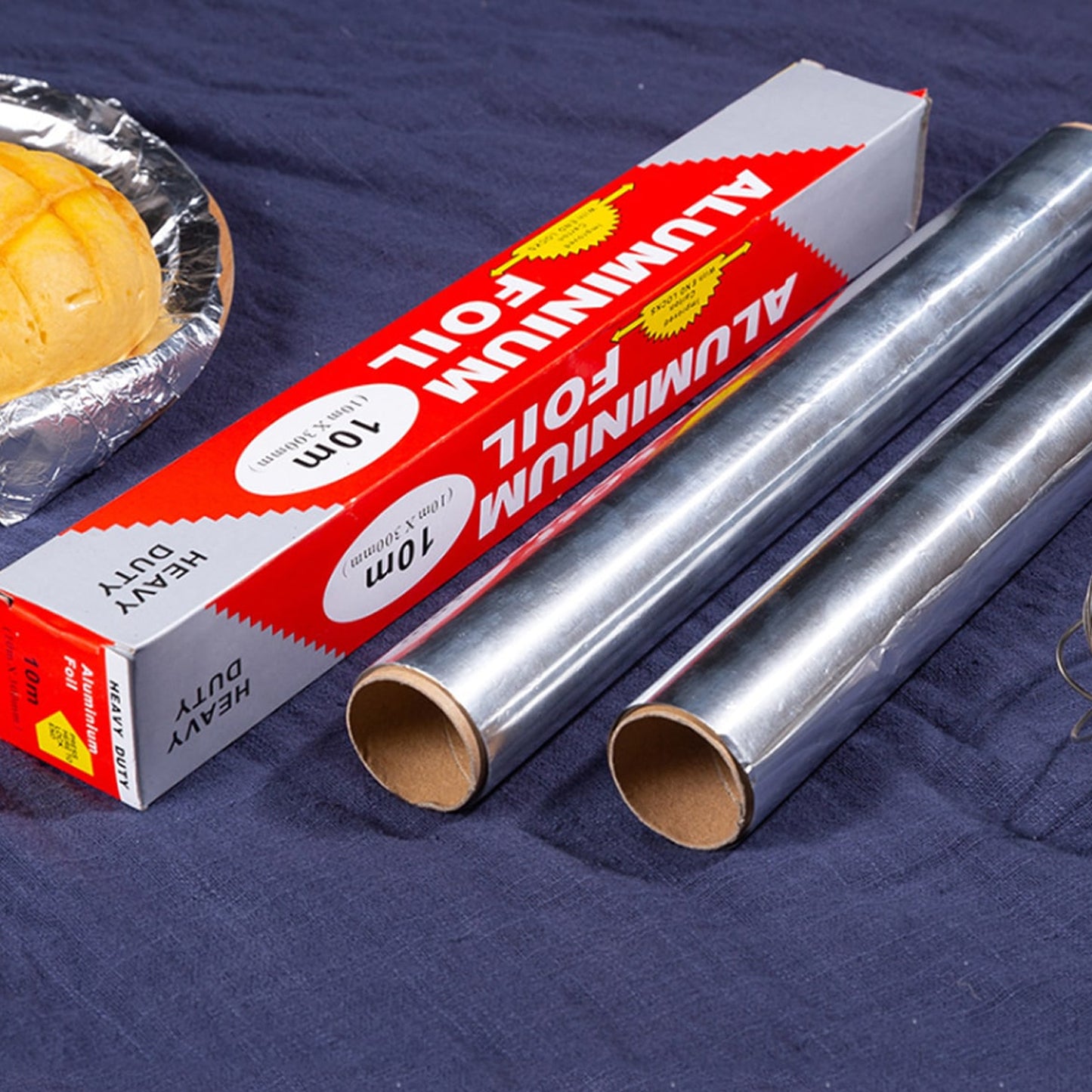 Wukusy heavy-duty aluminum foil roll with non-stick surface, 10m x 300mm, ideal for baking and grilling in the kitchen.