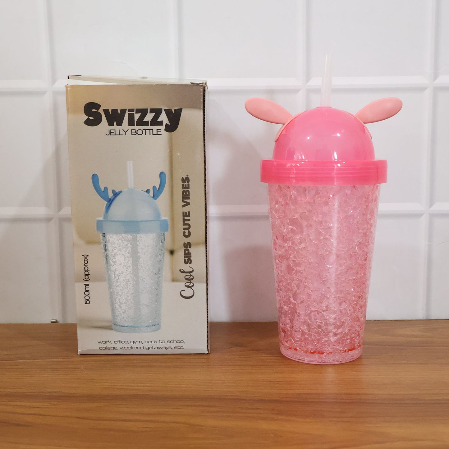 Wukusy cute bunny ear design 500ml tumbler sipper bottle with pink and white color, featuring bunny ear-shaped lid and clear body.