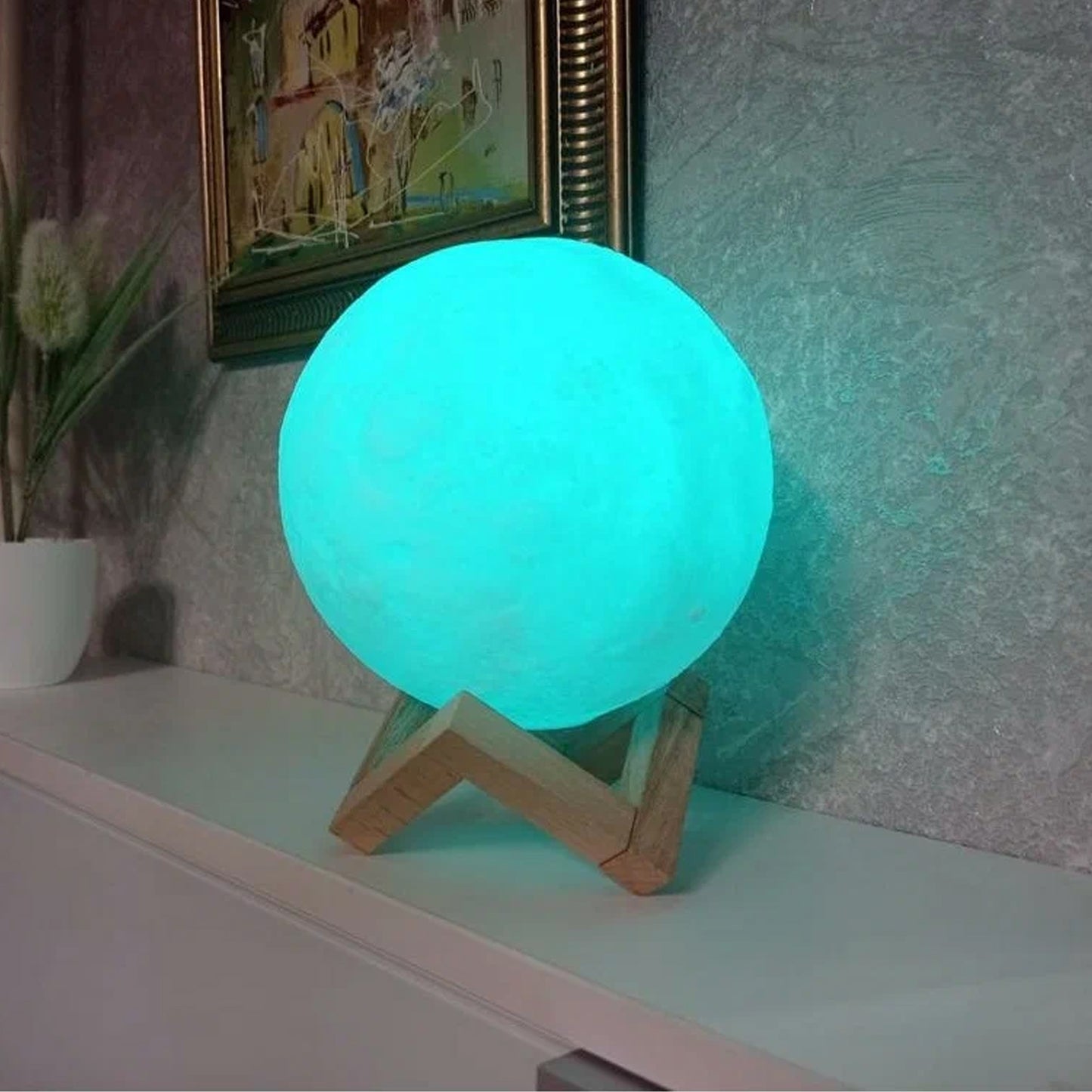 Blue moon night lamp by Wukusy with plastic stand, 15x12 cm, ideal for home decor, featuring a glowing moon design.