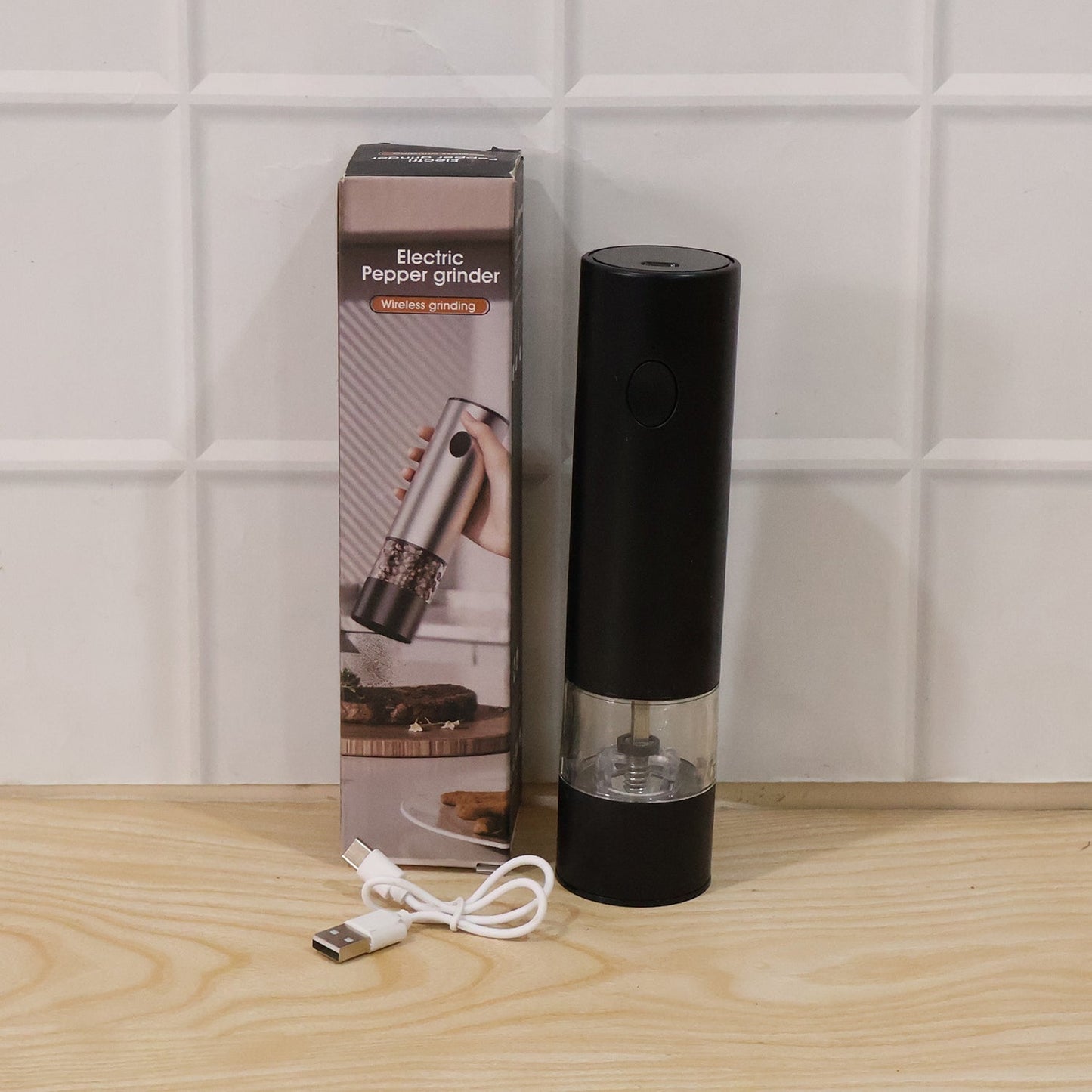Wukusy electric pepper grinder with USB charging and one-touch operation, close-up of stainless steel grinder with peppercorns