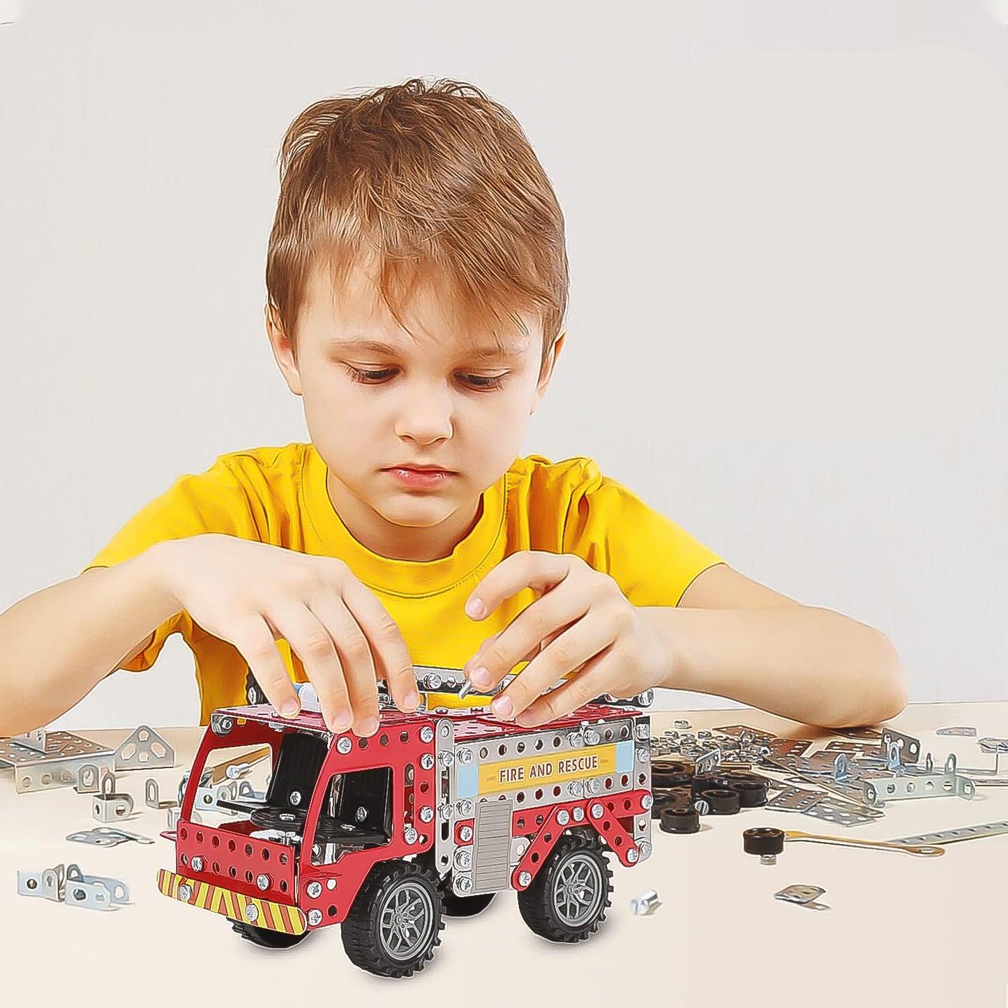 Wukusy metal DIY fire truck building blocks set for kids with 292 pieces, featuring a fire truck and tools for imaginative play.
