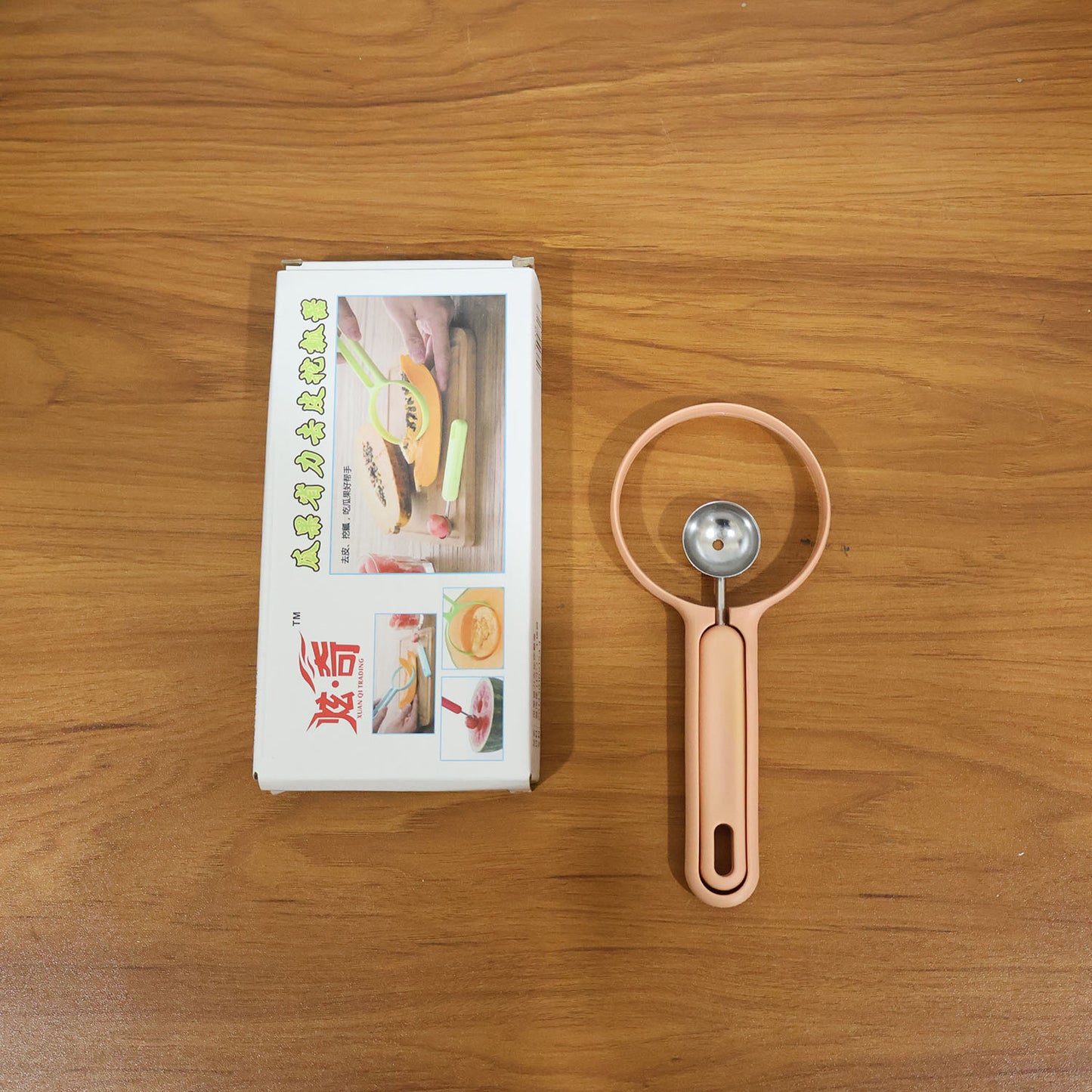 Wukusy 2-in-1 fruit scooper and cutter tool, handheld kitchen gadget for easy fruit prep and serving, shown in use