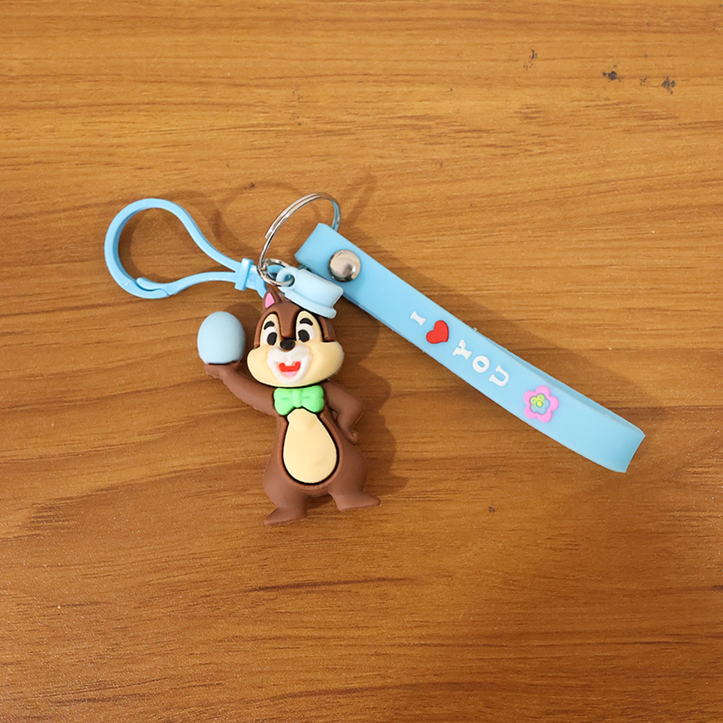 Cute cartoon squirrel keychain by Wukusy featuring a detailed squirrel design on a small metal keyring.
