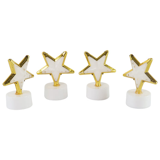Set of four Wukusy star-shaped flameless LED candles for home decor, glowing softly with warm light.