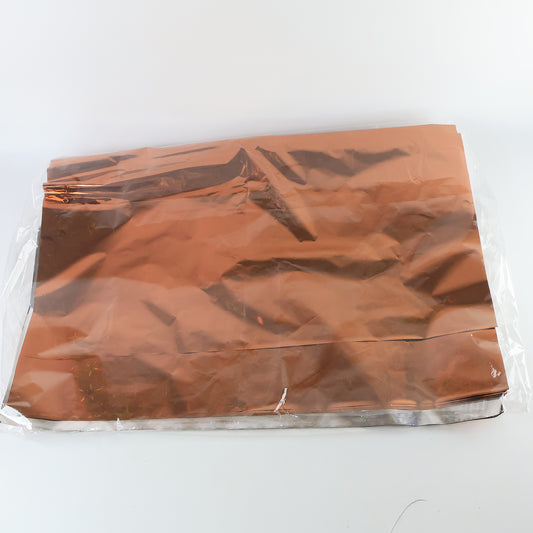 Assorted metallic gift wrapping paper sheets in mix colors, 70x50 cm, from Wukusy, displayed in a stack.