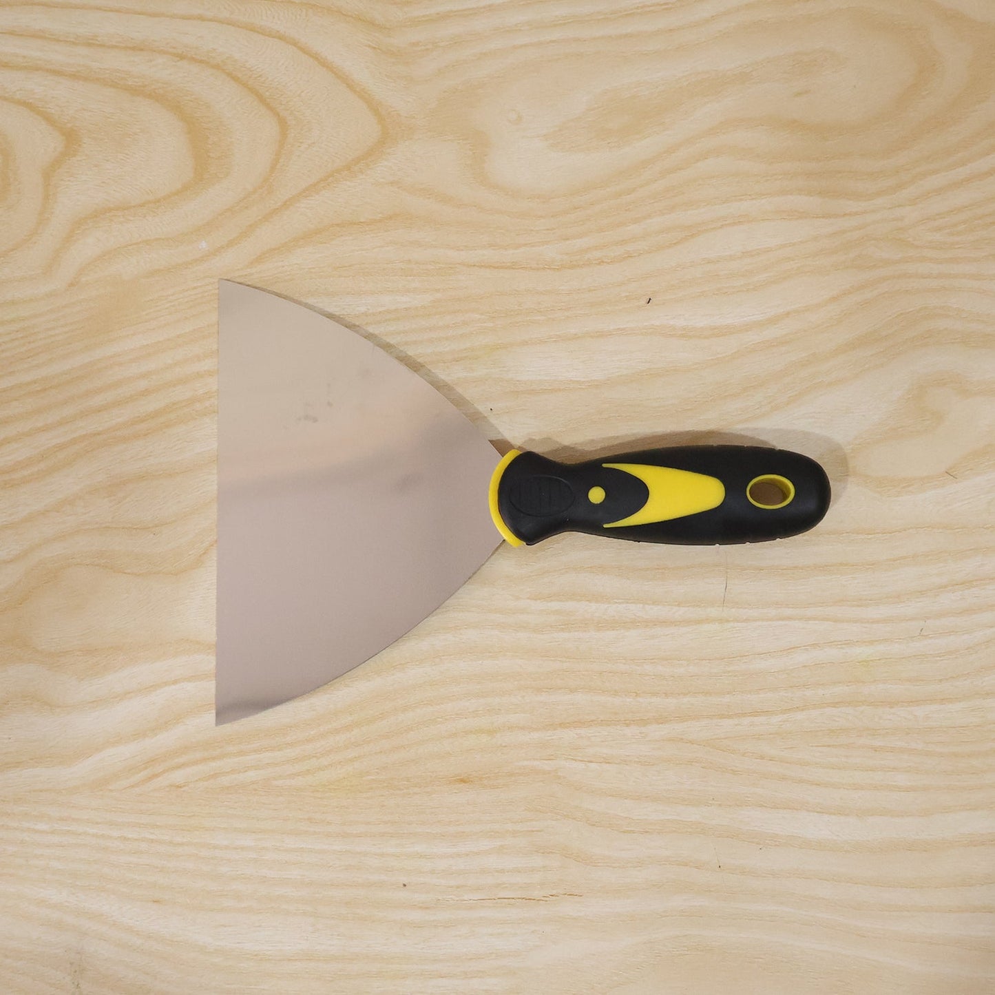 Wukusy stainless steel putty scraper with 145mm flexible blade for wall filler, shown in a close-up view.