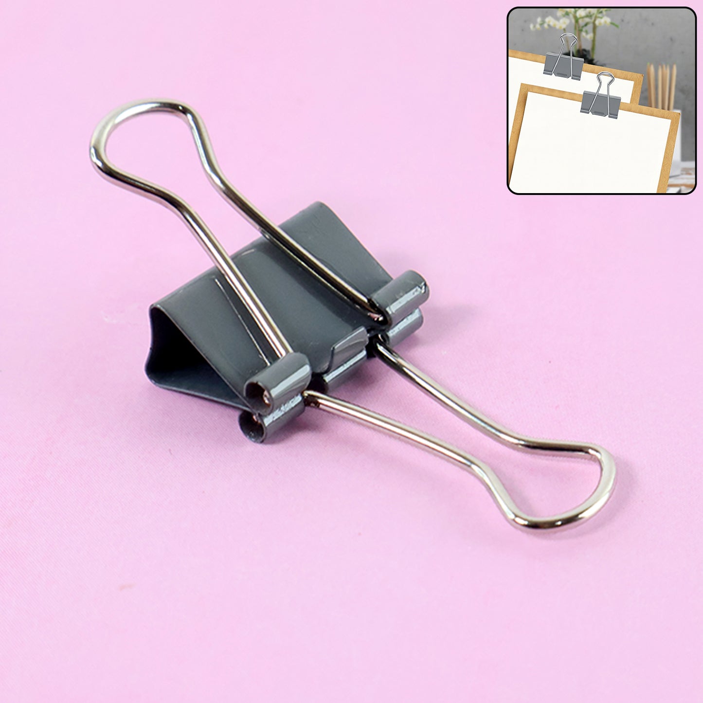 Wukusy heavy-duty foldback binder clip holding papers, sturdy metal clip for home improvement and organization tasks.